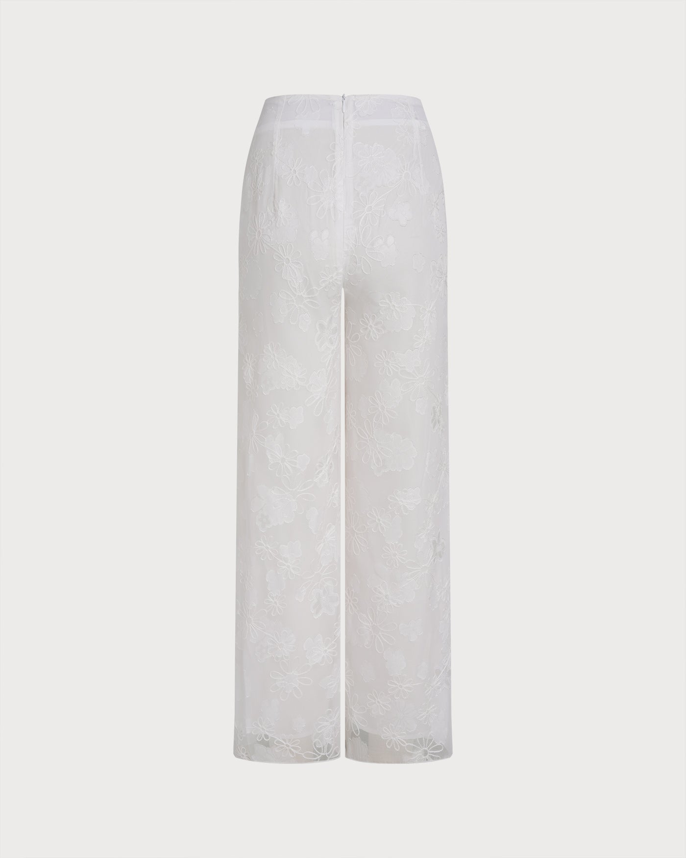 Weiße Hose mit Blumenstruktur und elastischem Bund