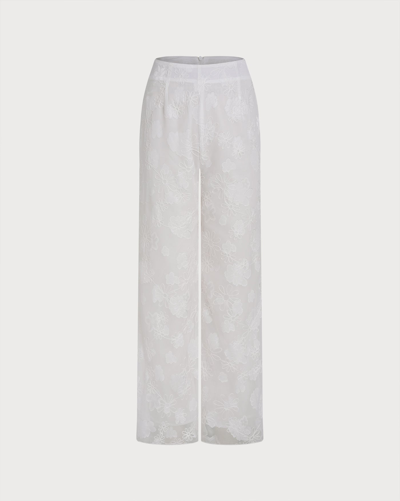 Weiße Hose mit Blumenstruktur und elastischem Bund