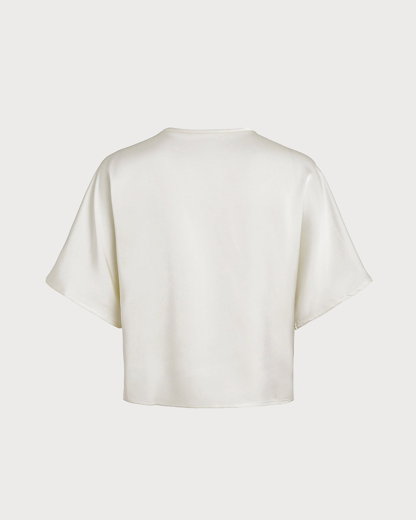 Aprikotfarbenes T-Shirt mit V-Ausschnitt und Knöpfen