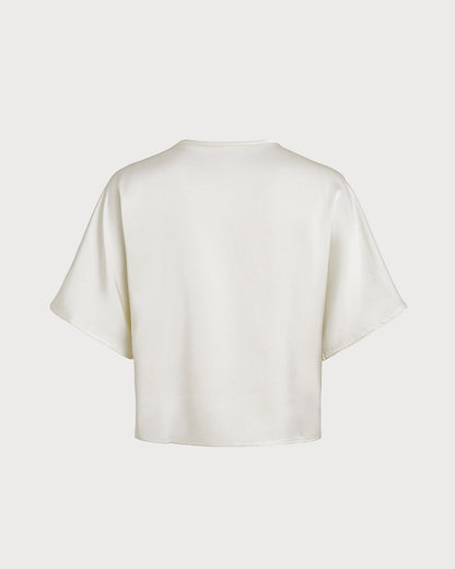 Aprikotfarbenes T-Shirt mit V-Ausschnitt und Knöpfen